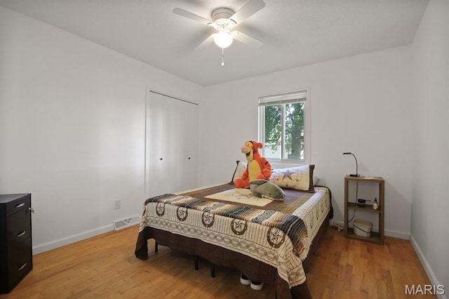31337 Hudson Rd, Lebanon, MO 65536 - bedroom with light wood finished floors, a closet, and a ceiling fan