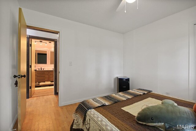31337 Hudson Rd, Lebanon, MO 65536 - bedroom with light wood-style flooring and a ceiling fan