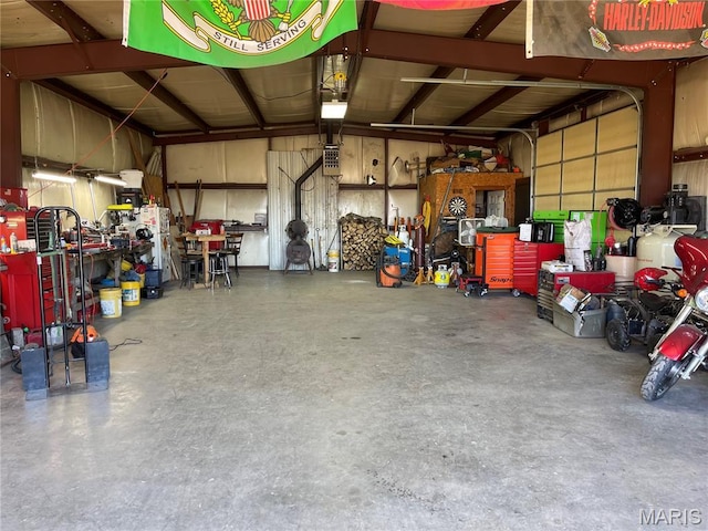 31337 Hudson Rd, Lebanon, MO 65536 - garage featuring a workshop area and a garage door opener