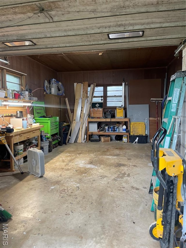 31337 Hudson Rd, Lebanon, MO 65536 - garage featuring a workshop area and wooden walls