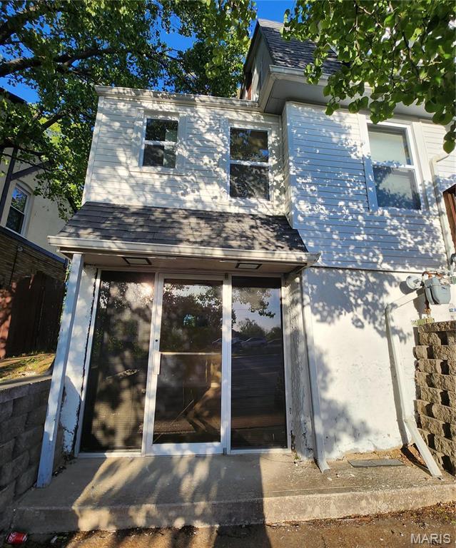 2020 S Brentwood Blvd, Saint Louis, MO 63144 - back of property with roof with shingles