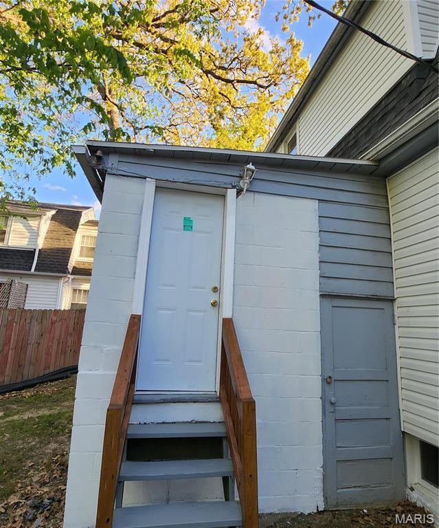 2020 S Brentwood Blvd, Saint Louis, MO 63144 - doorway to property featuring concrete block siding