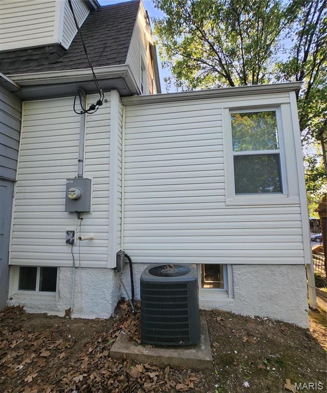 2020 S Brentwood Blvd, Saint Louis, MO 63144 - view of home's exterior with a central air condition unit and a shingled roof