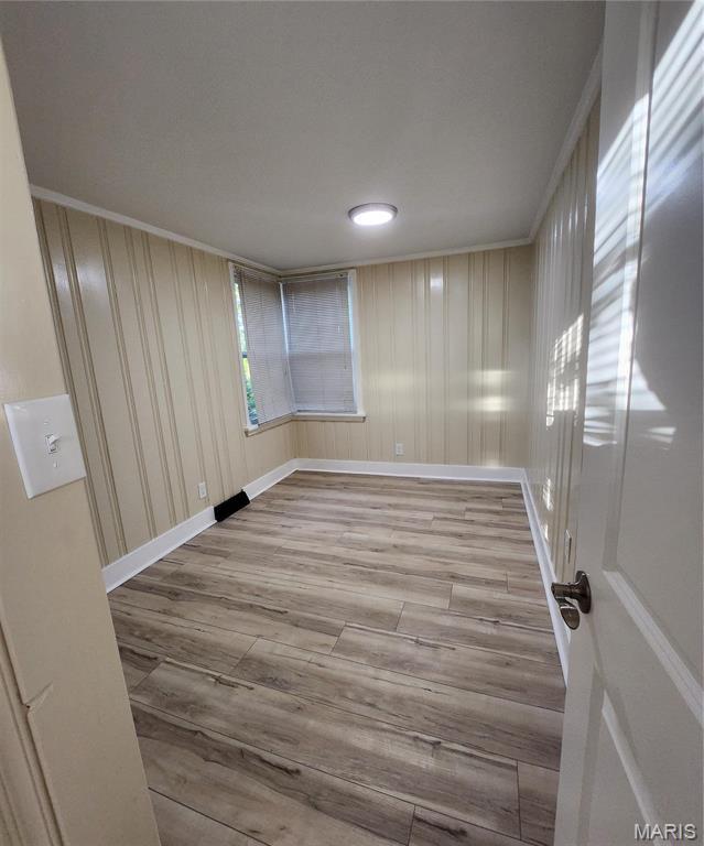2020 S Brentwood Blvd, Saint Louis, MO 63144 - empty room featuring crown molding and wood finished floors