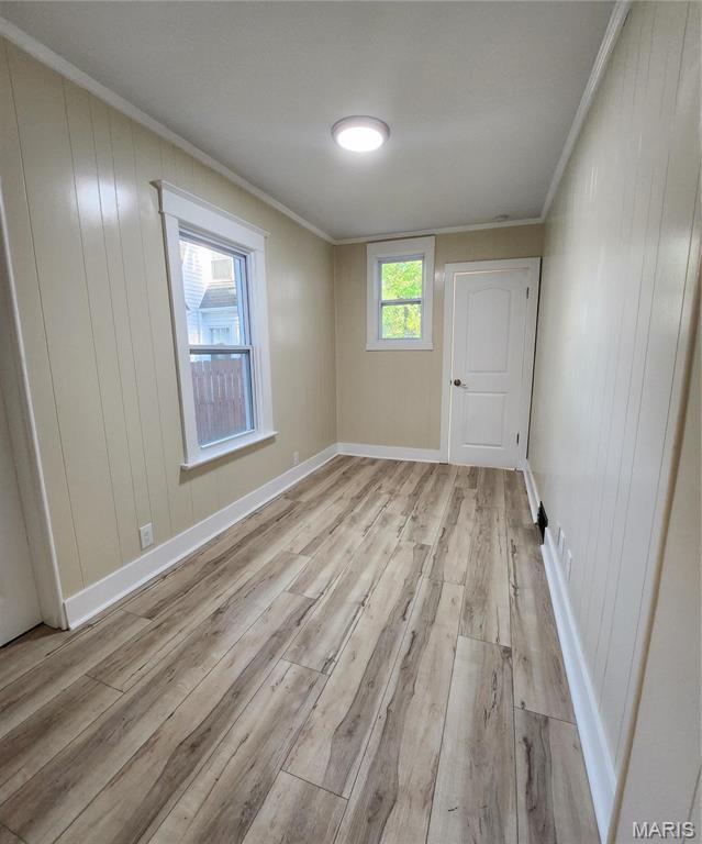 2020 S Brentwood Blvd, Saint Louis, MO 63144 - empty room featuring ornamental molding and light wood-type flooring