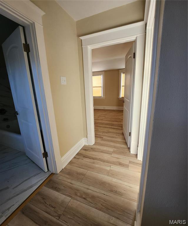 2020 S Brentwood Blvd, Saint Louis, MO 63144 - hall featuring light wood finished floors and baseboards