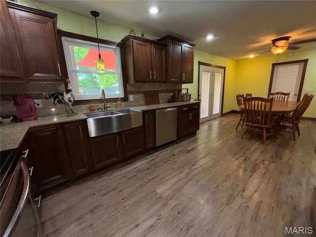 208 E Main St, Iberia, MO 65486 - kitchen featuring stove, dishwasher, light wood-type flooring, dark brown cabinetry, and hanging light fixtures