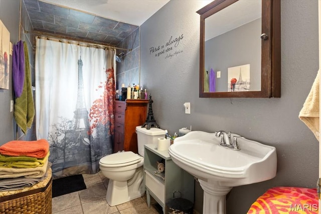 208 E Main St, Iberia, MO 65486 - bathroom with curtained shower and tile patterned floors
