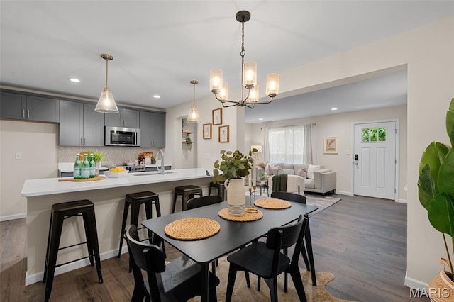 618 Maple Frst, Saint Louis, MO 63122 - dining room with dark wood-style flooring, a chandelier, and recessed lighting