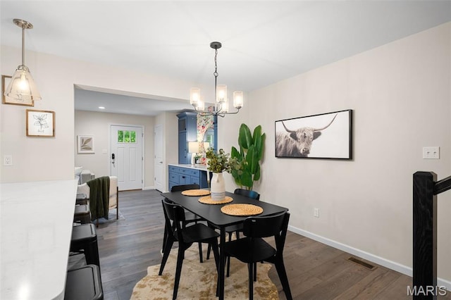 618 Maple Frst, Saint Louis, MO 63122 - dining space featuring a chandelier and dark wood-style floors