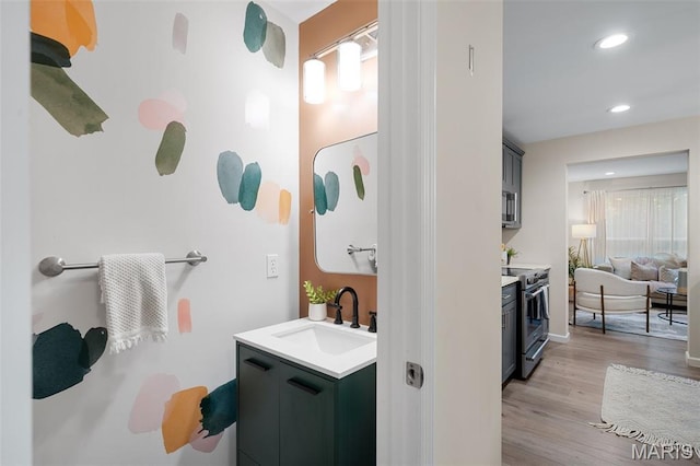 618 Maple Frst, Saint Louis, MO 63122 - bathroom featuring vanity, wood finished floors, and recessed lighting