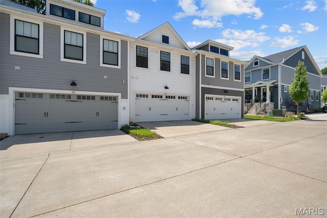 618 Maple Frst, Saint Louis, MO 63122 - townhome / multi-family property with a garage and driveway
