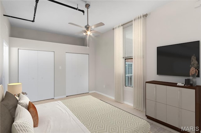 1501 Locust St Unit 909, Saint Louis, MO 63103 - bedroom featuring multiple closets and a ceiling fan