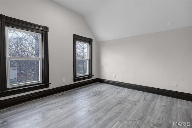 5123 Wicklow Pl, Saint Louis, MO 63111 - empty room featuring vaulted ceiling and wood finished floors
