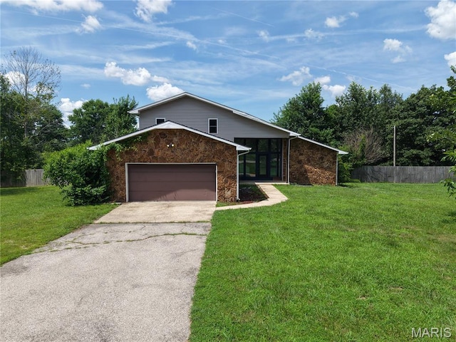 20055 Simmons Rd, Waynesville, MO 65583 - view of front of property featuring driveway, a garage, and stone siding