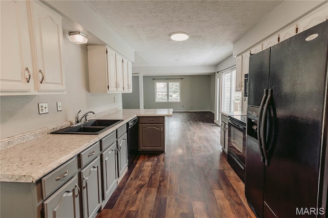 20055 Simmons Rd, Waynesville, MO 65583 - kitchen featuring black appliances, light countertops, dark wood-style floors, a peninsula, and a textured ceiling