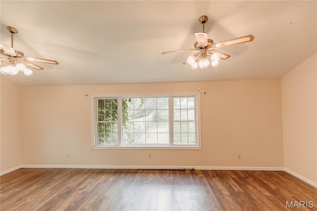 20055 Simmons Rd, Waynesville, MO 65583 - spare room featuring a ceiling fan, wood finished floors, and a textured ceiling