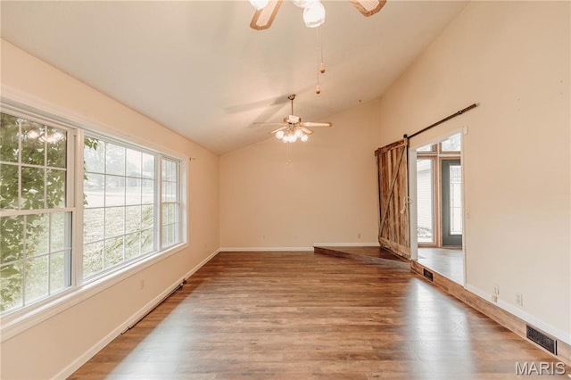 20055 Simmons Rd, Waynesville, MO 65583 - empty room featuring ceiling fan, healthy amount of natural light, wood finished floors, and lofted ceiling