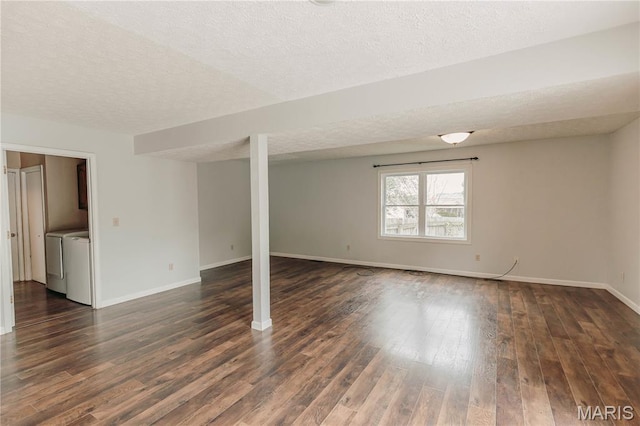 20055 Simmons Rd, Waynesville, MO 65583 - unfurnished room featuring a textured ceiling, washer and clothes dryer, and dark wood-style flooring