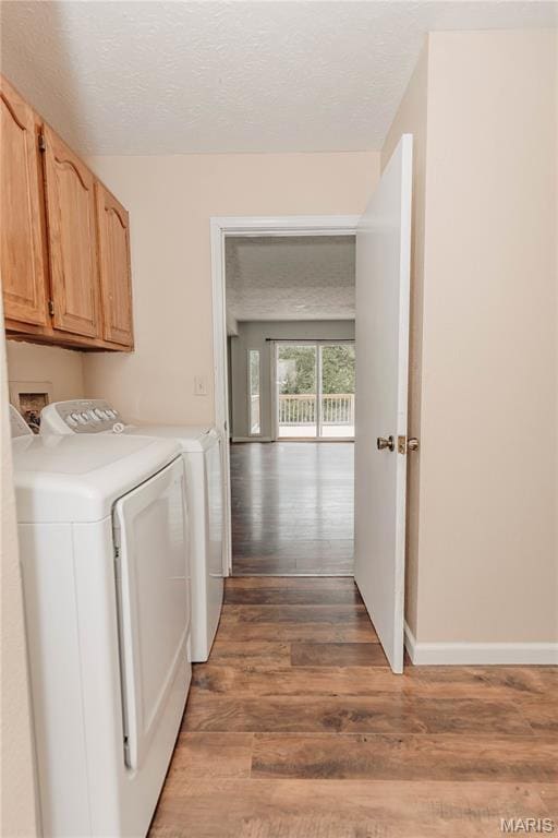 20055 Simmons Rd, Waynesville, MO 65583 - washroom with cabinet space, independent washer and dryer, light wood-style floors, and a textured ceiling