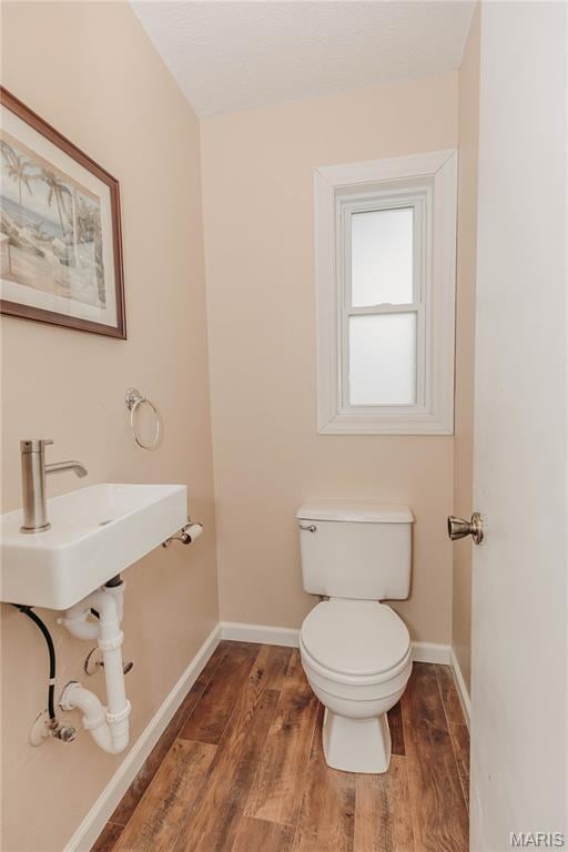 20055 Simmons Rd, Waynesville, MO 65583 - half bathroom with wood finished floors