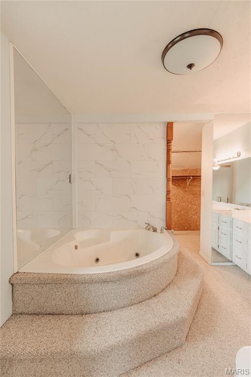 20055 Simmons Rd, Waynesville, MO 65583 - bathroom with a tub with jets and vanity