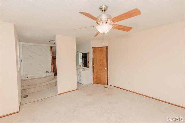 20055 Simmons Rd, Waynesville, MO 65583 - unfurnished bedroom with light carpet, ensuite bath, and ceiling fan