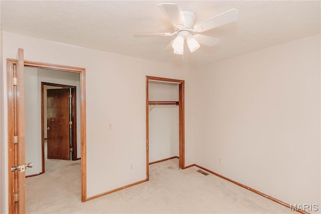 20055 Simmons Rd, Waynesville, MO 65583 - unfurnished bedroom featuring light colored carpet, a closet, and ceiling fan