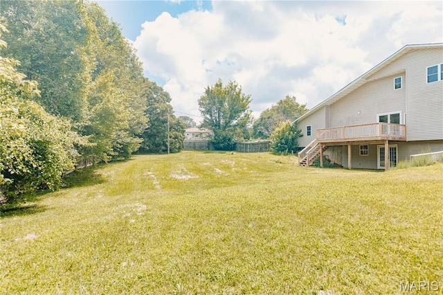 20055 Simmons Rd, Waynesville, MO 65583 - view of grassy yard with stairs and a wooden deck