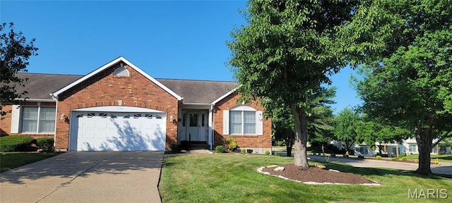 2154 Ingalls Cir Unit 1451C, Ofallon, MO 63368 - view of front of home featuring a garage, concrete driveway, a front lawn, and brick siding