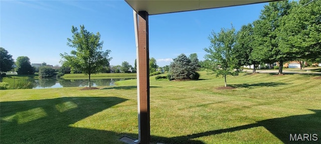 2154 Ingalls Cir Unit 1451C, Ofallon, MO 63368 - view of grassy yard featuring a water view