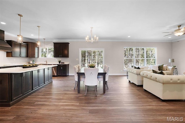 5 Schaper Farms Ct, Foristell, MO 63348 - dining area with dark wood finished floors, recessed lighting, a chandelier, ornamental molding, and a ceiling fan