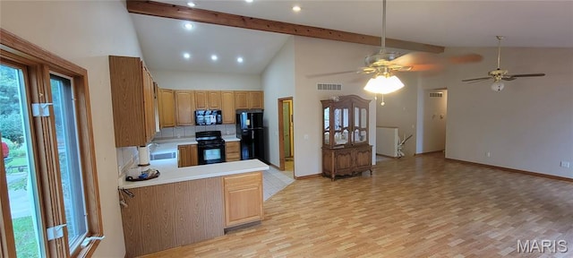 11112 Morrow Dr, Saint Ann, MO 63074 - kitchen with light wood-type flooring, black appliances, light countertops, and open floor plan