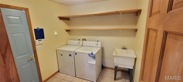 11112 Morrow Dr, Saint Ann, MO 63074 - washroom featuring washing machine and dryer and light tile patterned flooring