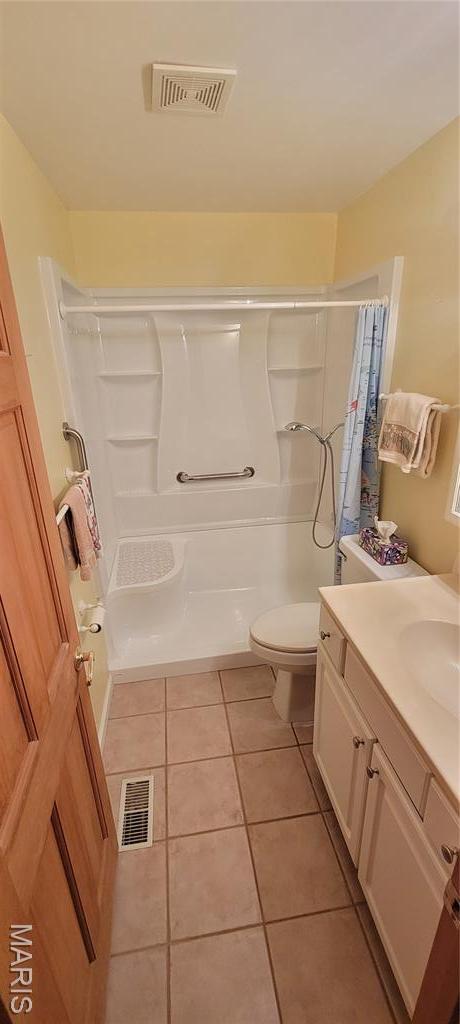 11112 Morrow Dr, Saint Ann, MO 63074 - bathroom with vanity and tile patterned floors