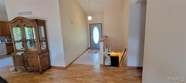 11112 Morrow Dr, Saint Ann, MO 63074 - entryway with high vaulted ceiling and light wood-style floors