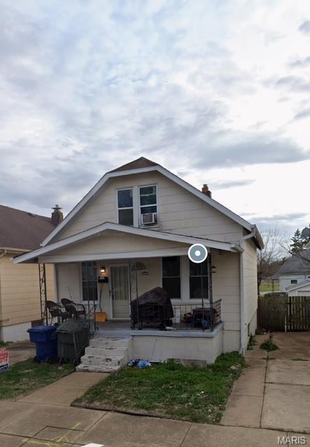 4666 Tesson St, Saint Louis, MO 63116 - bungalow-style home featuring covered porch and cooling unit