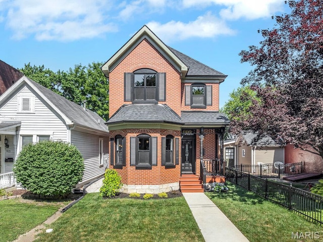 909 S 4th St, Saint Charles, MO 63301 - view of front facade featuring brick siding, roof with shingles, and a porch