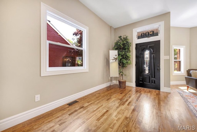 909 S 4th St, Saint Charles, MO 63301 - foyer featuring baseboards and wood finished floors