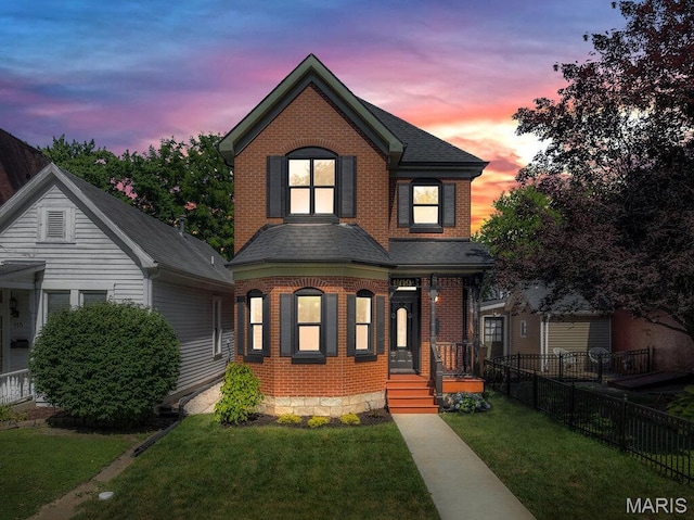 909 S 4th St, Saint Charles, MO 63301 - view of front facade featuring brick siding, a porch, and a shingled roof