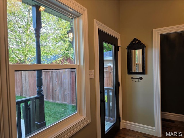 909 S 4th St, Saint Charles, MO 63301 - entryway featuring baseboards and dark wood-style flooring