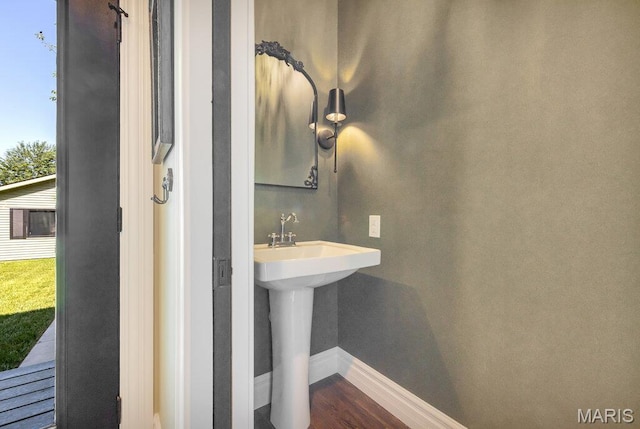 909 S 4th St, Saint Charles, MO 63301 - bathroom featuring baseboards and wood finished floors