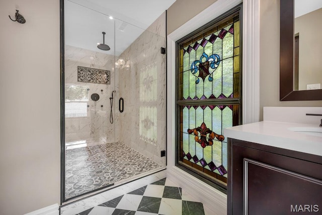 909 S 4th St, Saint Charles, MO 63301 - full bathroom with a marble finish shower, vanity, and healthy amount of natural light