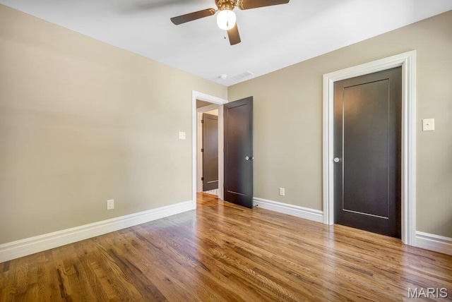 909 S 4th St, Saint Charles, MO 63301 - unfurnished bedroom featuring wood finished floors and ceiling fan