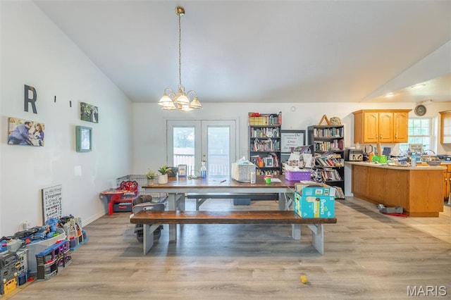 2635 Linda Ln, Poplar Bluff, MO 63901 - dining space with lofted ceiling, light wood finished floors, a chandelier, and french doors