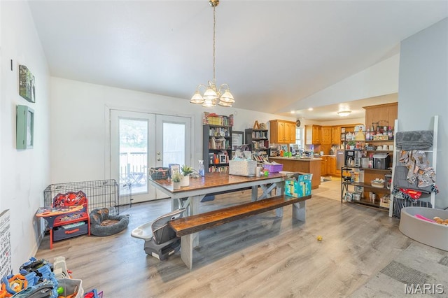 2635 Linda Ln, Poplar Bluff, MO 63901 - dining area with vaulted ceiling, light wood-style floors, french doors, and a chandelier