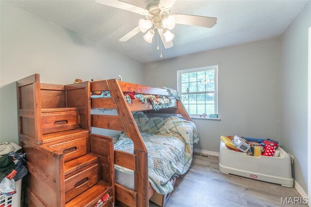 2635 Linda Ln, Poplar Bluff, MO 63901 - bedroom with wood finished floors and a ceiling fan