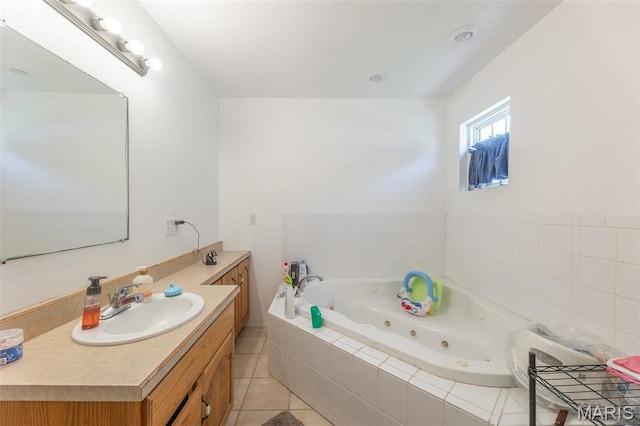 2635 Linda Ln, Poplar Bluff, MO 63901 - bathroom featuring a tub with jets, vanity, and tile patterned floors
