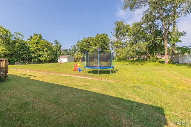 2635 Linda Ln, Poplar Bluff, MO 63901 - view of green lawn featuring a trampoline, a shed, and a playground