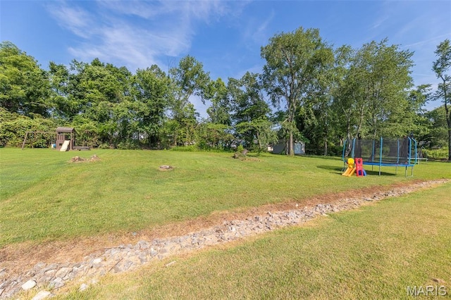 2635 Linda Ln, Poplar Bluff, MO 63901 - view of green lawn featuring a trampoline and view of scattered trees